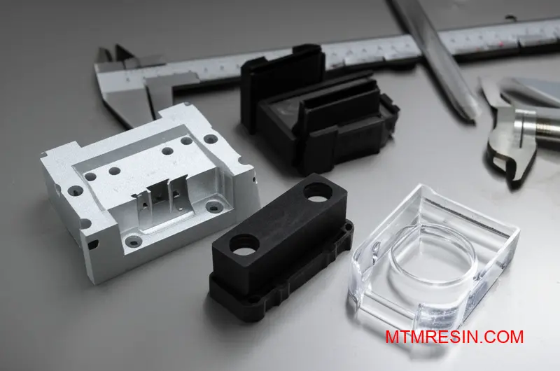 Precision molded structural parts made from high-performance thermoplastic materials including polybutylene terephthalate variants for industrial applications