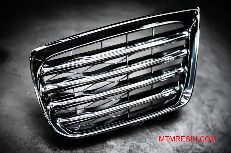 A detailed view of a premium, chrome-finished automotive component made from a PC/ABS composite.