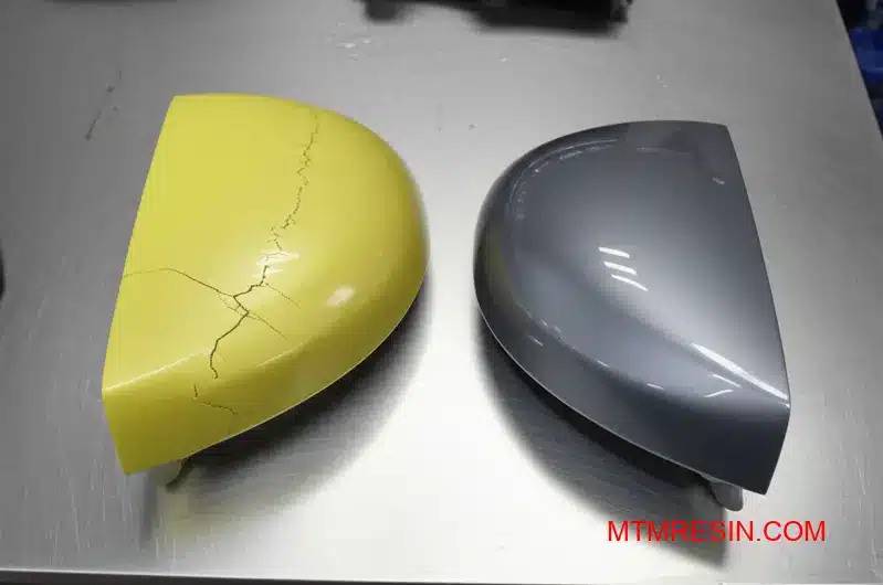 A weathered ABS part next to a pristine component made from a durable ASA polymer.