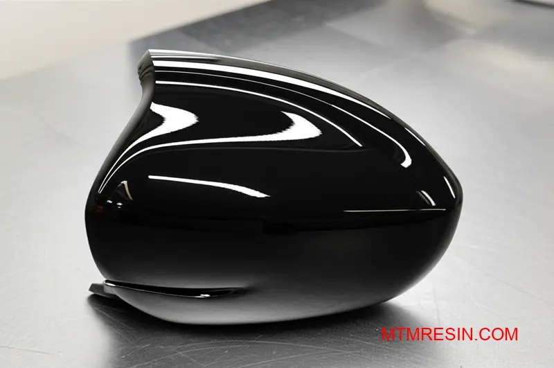 Close-up of a durable, weather-resistant ASA polymer car mirror housing with a perfect Class-A surface.