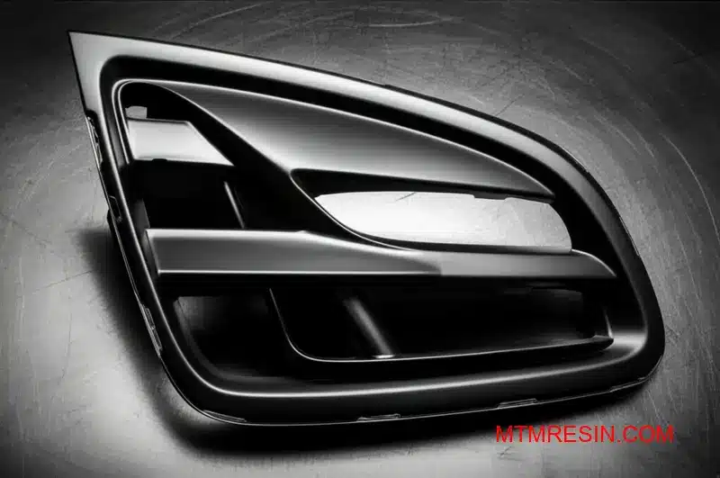 Elegancka szara część samochodowa demonstrująca trwałość wysokoudarowego polimeru, takiego jak Geloy HRA170.